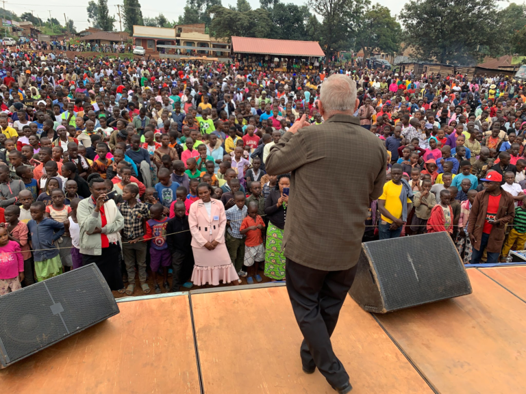 Peter Doseck preaching to a large crowd