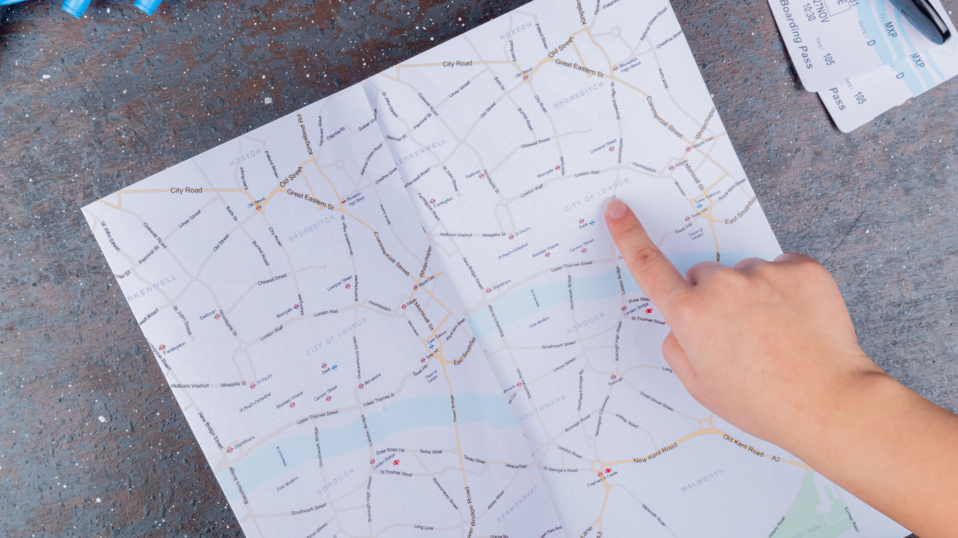 person pointing on a map