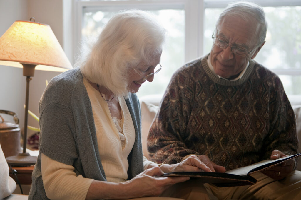 Senior couple looking through photo album